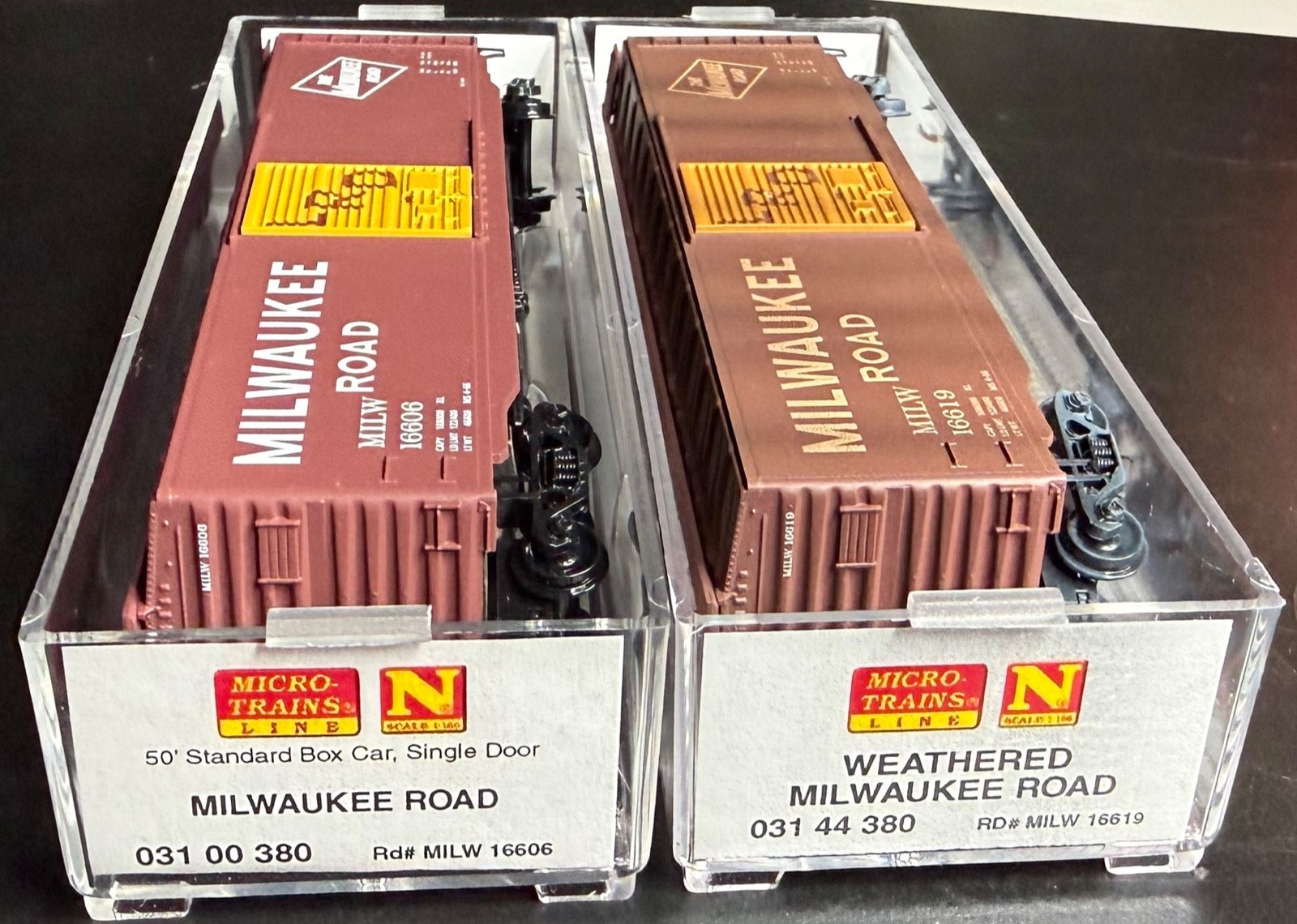 N scale Micro-trains Milwaukee Road 2 box cars weathered 03144380 &03100380