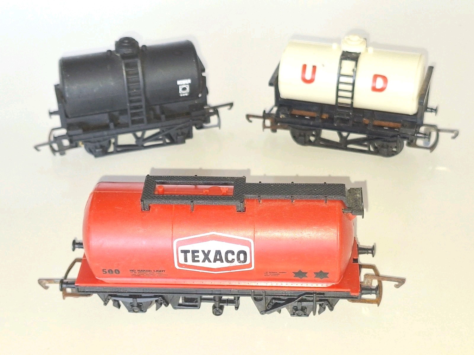 Hornby Mixed Tanker Cars x 3. In Good overall condition. OO Scale. No Box.