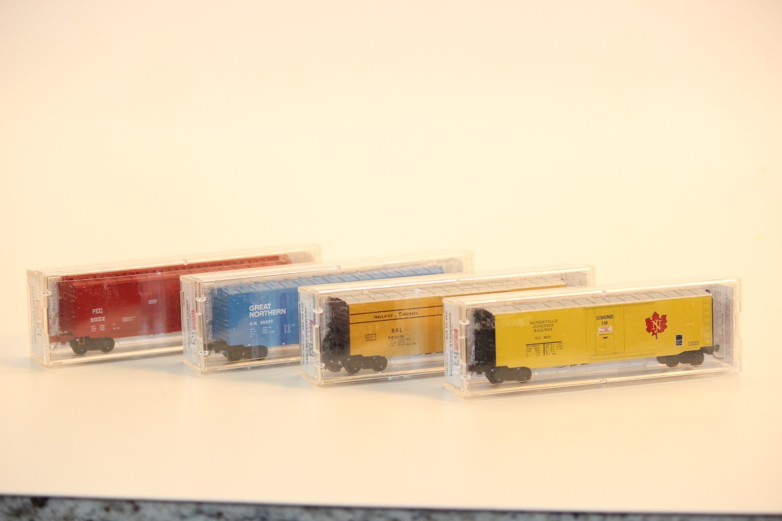 Lot of 4 MTL 50′ Boxcars var. roads GN, FEC, NJ, SAL N Scale