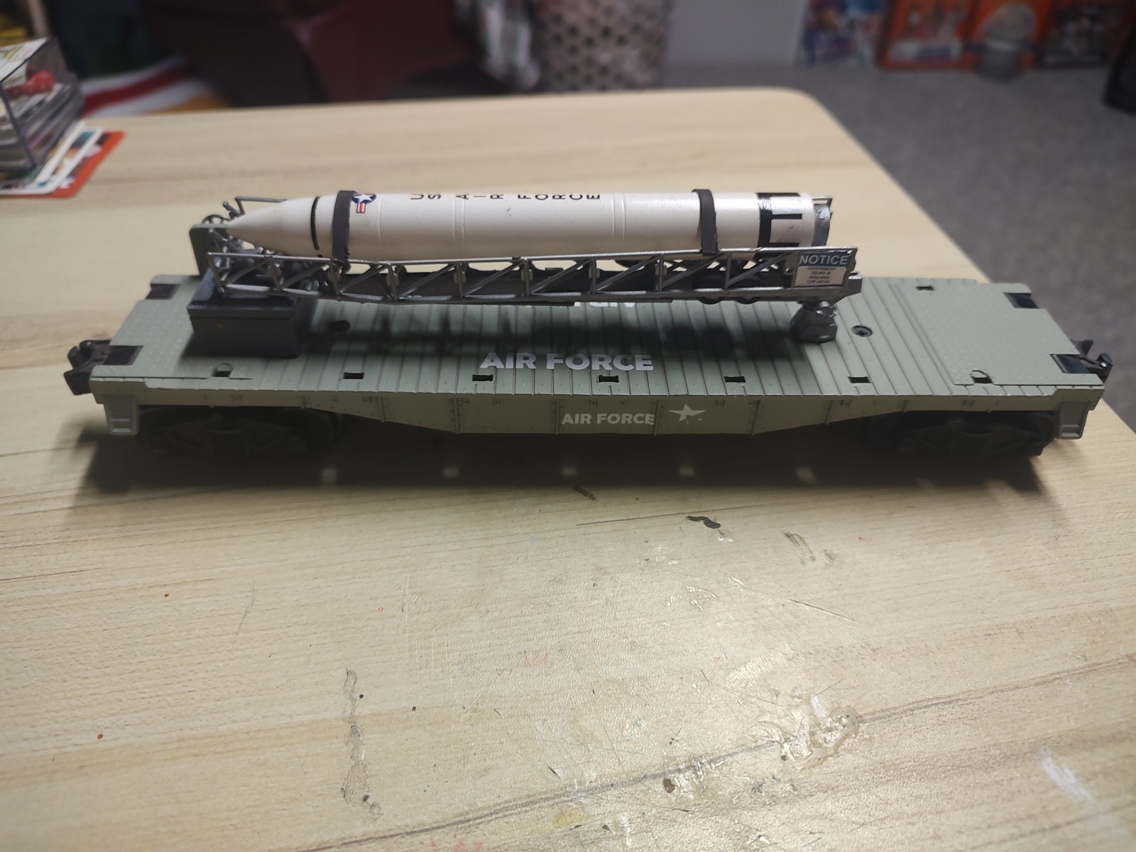 Lionel Flat car with a rocket and cradle that lifts up. With 3D printed crate an