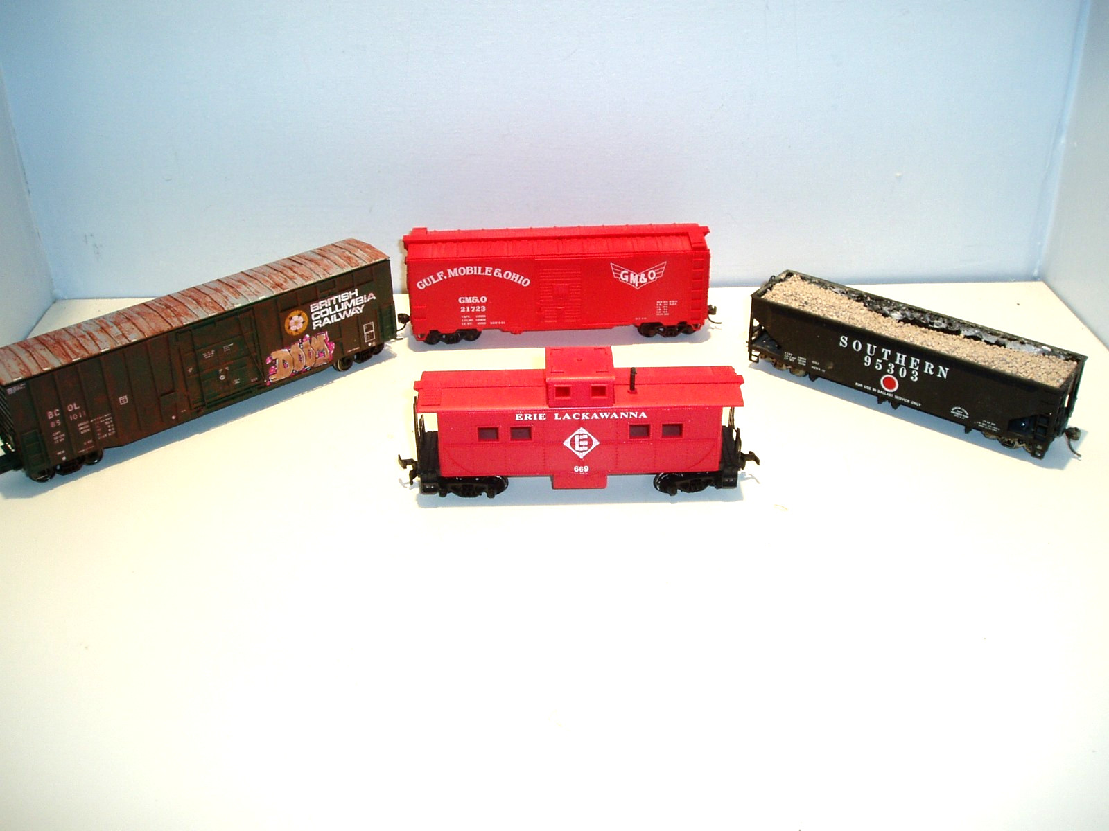 4 HO freight cars, various manufacturers, may need minor repair.