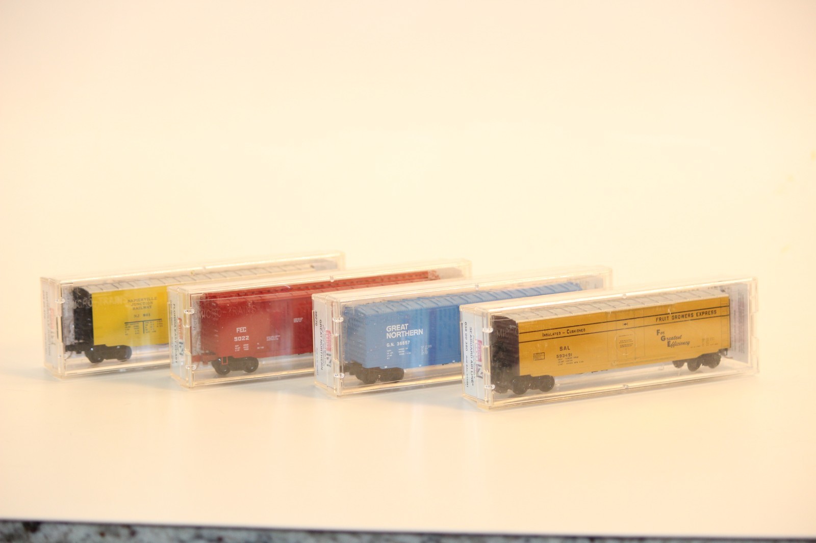 Lot of 4 MTL 50′ Boxcars var. roads GN, FEC, NJ, SAL N Scale