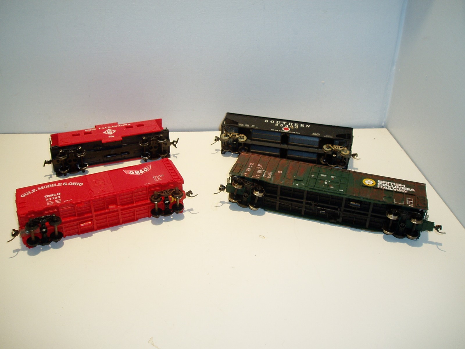 4 HO freight cars, various manufacturers, may need minor repair.