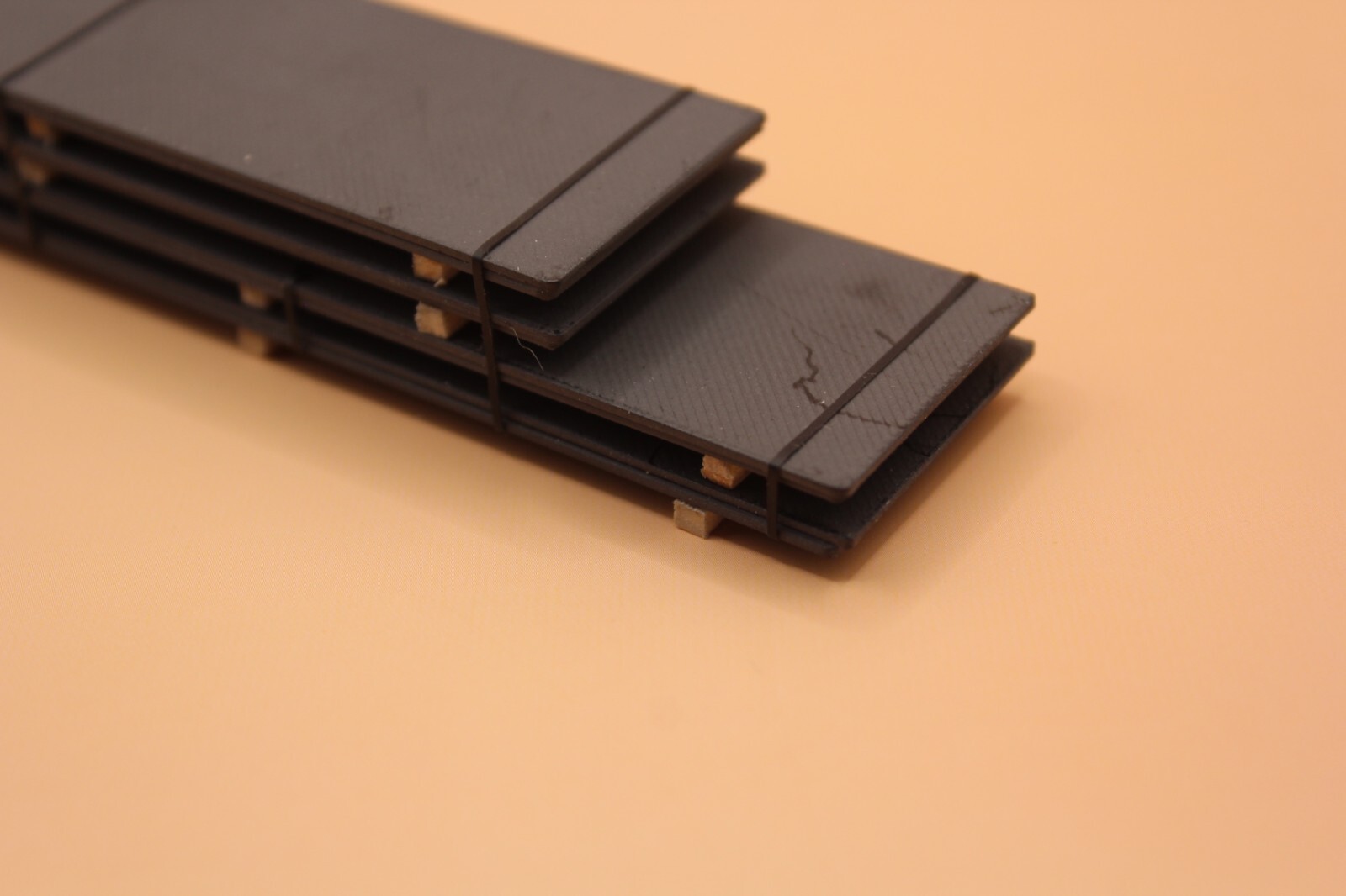 224159 HO- Scale handmade 45′ steel plates with 32′ topers painted dark gray