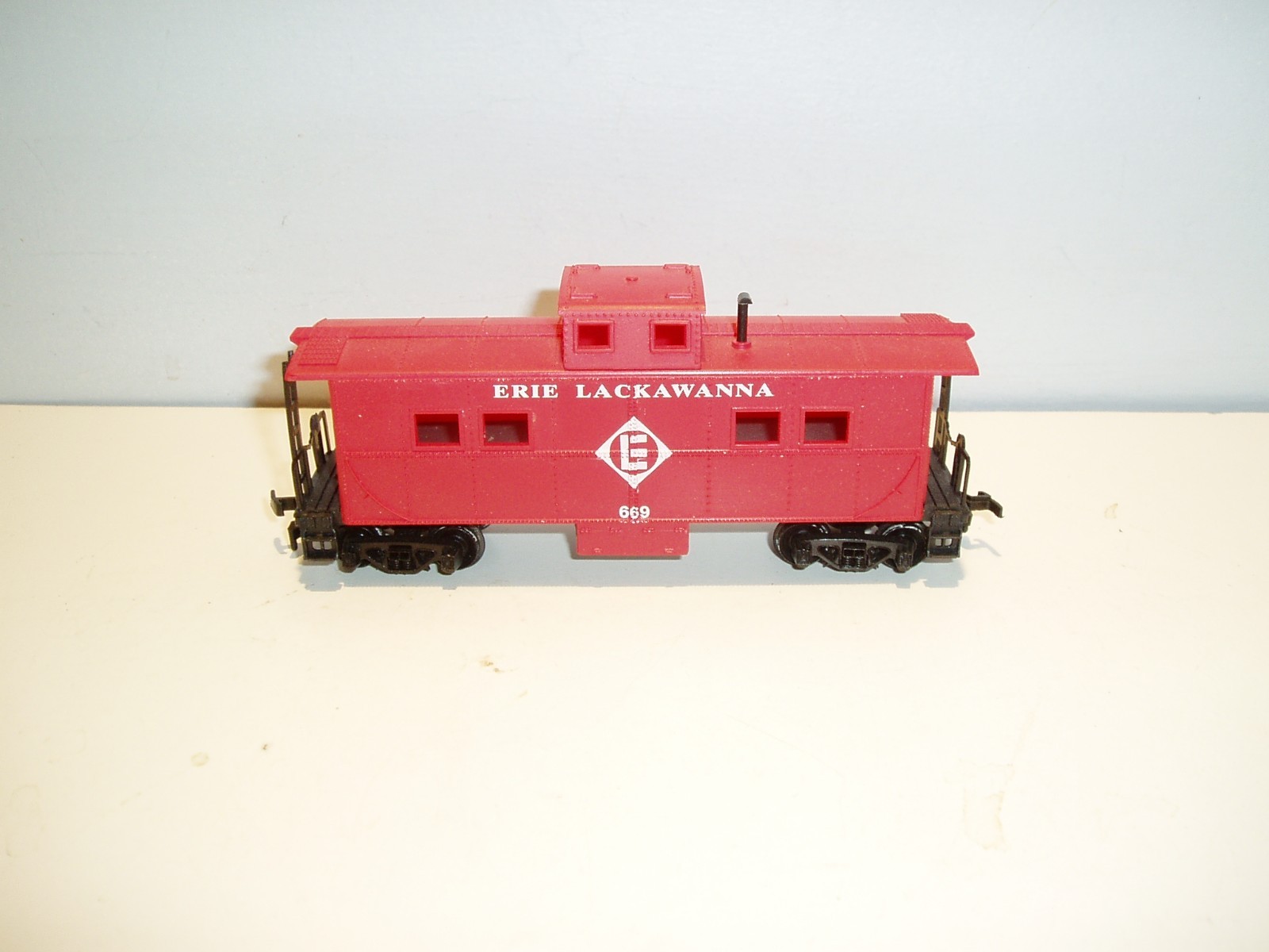 4 HO freight cars, various manufacturers, may need minor repair.
