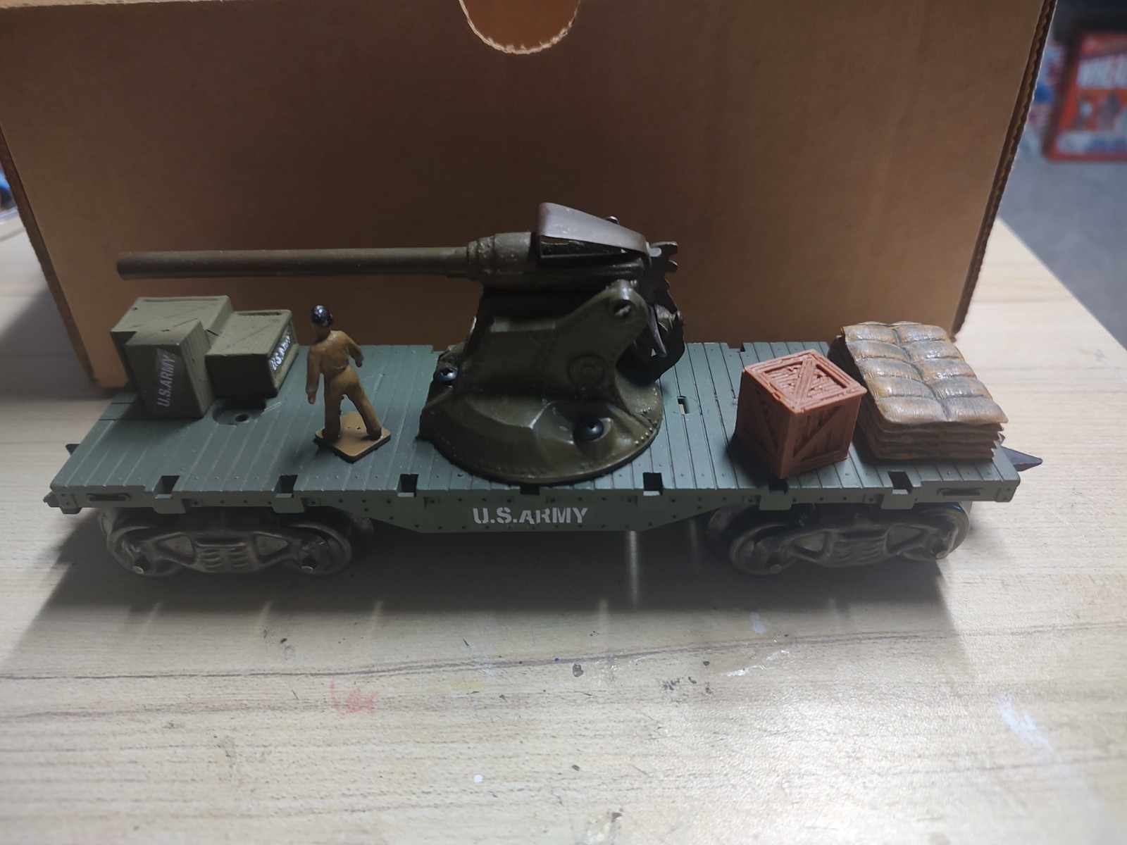 Marx painted flat car with New Britian’s cannon and accessories