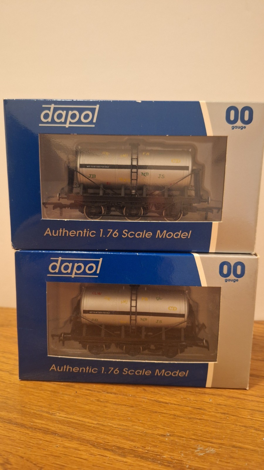 Two OO Gauge Dapol B908 6 Wheel Graffitied Milk Tankers. Rare wagons.