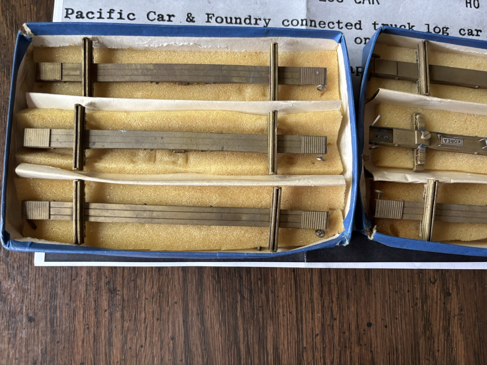 HO Brass Far East Dist. 50′ Skeleton Log Cars – Six Pieces, Unpainted