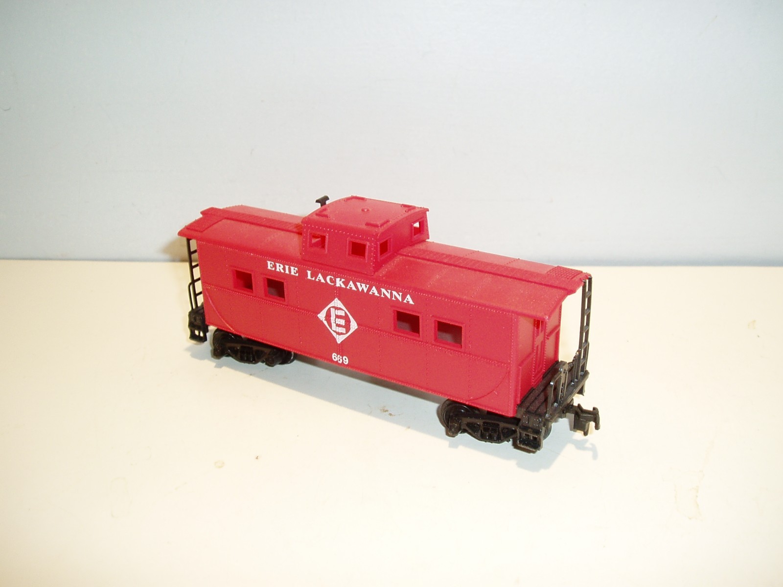 4 HO freight cars, various manufacturers, may need minor repair.